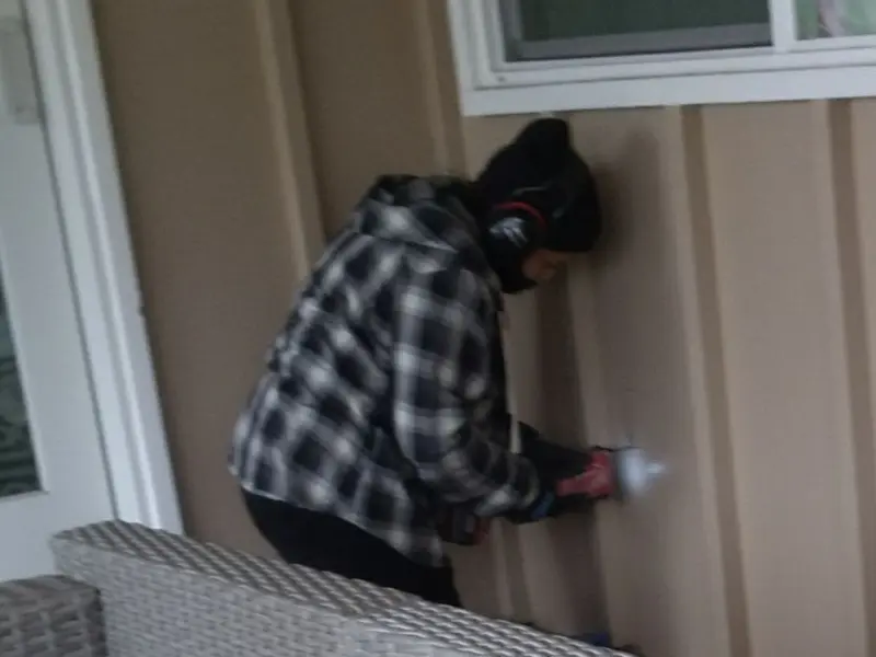 Professional electrician installing an exterior outlet in Wheatland